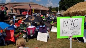 CORRECTS DAY OF WEEK TO TUESDAY INSTEAD OF FRIDAY - Supporters of jailed Rowan County Clerk Kim Davis gather outside the Carter County Detention Center in Grayson, Ky., Tuesday, Sept. 8, 2015. Presidential candidates former Arkansas Gov. Mike Huckabee and Texas Sen. Ted Cruz each planned jailhouse meetings Tuesday with Kentucky clerk Kim Davis, who remains behind bars over her refusal to give marriage licenses to gay couples. (AP Photo/Timothy D. Easley)