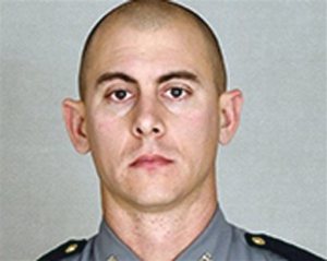 This undated photo provided by the Kentucky State Police shows Trooper Joseph Cameron Ponder. Ponder, who had been on the force less than a year was killed, late Sunday, Sept. 13, 2015, in a shooting during a car chase on Interstate 24, in Kentucky. Authorities are searching for the suspect. (Courtesy of the Kentucky State Police via AP)