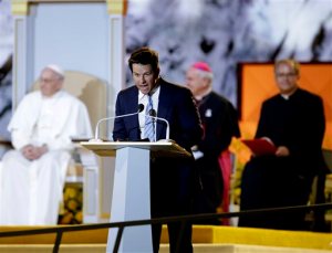 Actor Mark Wahlberg speaks as Pope Francis is seated nearby during the World Meeting of Families festival, Saturday, Sept. 26, 2015, in Philadelphia. (AP Photo/Matt Rourke, Pool)