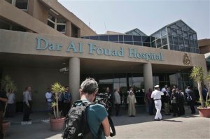 A journalist films the entrance of the Dar Al Fouad Hospital after the visit of Foreign Minister Claudia Ruiz Massieu to injured Mexican tourists, in Cairo, Egypt, Wednesday, Sept. 16, 2015. Massieu is in Cairo after Egyptian security forces mistakenly killed at least eight Mexican tourists on a desert safari. (AP Photo/Nariman El-Mofty)