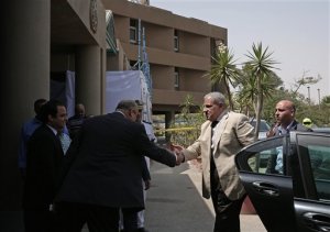 Acting Egyptian Prime Minister Ibrahim Mehleb shakes hands with officials as he arrives to visit injured Mexican tourists at the Dar Al Fouad Hospital in Cairo, Egypt, Monday, Sept. 14, 2015. At least 12 people were killed and 10 injured in Egypt's southwestern desert Sunday, Sept 13, 2015, when security forces mistakenly fired on a group of Mexican tourists on a safari trip, Egyptian officials said. The Mexican Foreign Ministry confirmed the incident and said at least two of the dead were Mexican nationals. (AP Photo/Nariman El-Mofty)