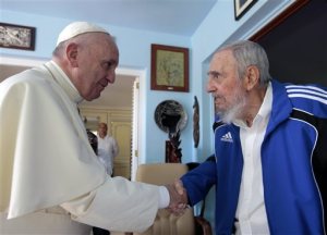Pope Francis and Cuba's Fidel Castro shake hands, in Havana, Cuba, Sunday, Sept. 20, 2015. The Vatican described the 40-minute meeting at Castro's residence as informal and familial, with an exchange of books. (AP Photo/Alex Castro)