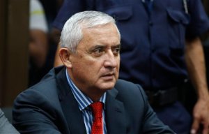 Guatemala's President Otto Perez Molina sits in court to face corruption charges, after he submitted his resignation in Guatemala City, Thursday, Sept. 3, 2015. The president submitted his resignation at midnight local time late Wednesday after a judge issued an order to detain him in a corruption scandal. Perez Molina was already under order not to leave the country, and on Tuesday the congress lifted his immunity from prosecution. (AP Photo/Luis Soto)