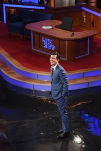 Stephen Colbert hosts the premiere episode of "The Late Show," Tuesday Sept. 8, 2015, in New York. Actor George Clooney and Republican presidential candidate Jeb Bush were the guests for Colbert's debut. (Jeffrey R. Staab/CBS via AP)