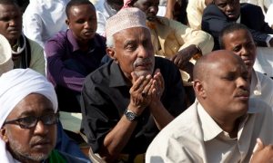 A Kenyan Muslim raises his hands as he offers prayers, Thursday, Sept. 24, 2015, in Nairobi, Kenya, during the Muslim feast of Eid al-Adha (the Festival of Sacrifice) which is celebrated throughout the Muslim world as a commemoration of Abraham's willingness to sacrifice his son for God. The festival falls on the tenth day of Zulhijjah, the final month of the Muslim Calendar. Cows, camels, goats and sheep are traditionally slaughtered on the holiest day.(AP Photo/Sayyid Azim)
