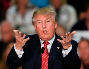 Republican presidential candidate Donald Trump gestures as he speaks during a rally at West High School in Sioux City, Iowa, Tuesday, Oct. 27, 2015. (AP Photo/Nati Harnik)