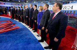 Republican presidential candidates, from left, former Pennsylvania Sen. Rick Santorum, former New York Gov. George Pataki,  Sen. Rand Paul, R-Ky., former Arkansas Gov. Mike Huckabee, Sen. Marco Rubio, R-Fla., Sen. Ted Cruz, R-Texas, retired neurosurgeon Ben Carson, businessman Donald Trump, former Florida Gov. Jeb Bush, Wisconsin Gov. Scott Walker, businesswoman Carly Fiorina, Ohio Gov. John Kasich, and New Jersey Gov. Chris Christie take the stage during the CNN Republican presidential debate at the Ronald Reagan Presidential Library and Museum on Wednesday, Sept. 16, 2015, in Simi Valley, Calif. (AP Photo/Chris Carlson)