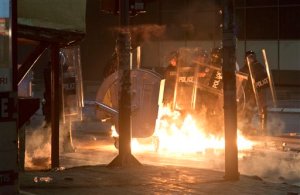 Molotov cocktail is thrown at the police officers in Kosovo capital Pristina as clashes broke out after the arrest of a prominent opposition politician Albin Kurti on Monday, Oct. 12, 2015. The main opposition parties have been protesting governments recent EU-sponsored deal with authorities in Serbia that give Kosovos Serb minority greater rights in areas where they live.  Albin Kurti, who is a leader of the nationalist Vetvendosje movement, set off a teargas canister inside Kosovos Parliament in an attempt to halt the proceedings. (AP Photo/Visar Kryeziu)