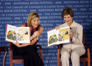 FILE - In this Sept. 27, 2008 file photo, first lady Laura Bush, right, and her daughter Jenna Bush Hager read their book "Read All About It!" during the National Book Festival in Washington. HarperCollins Publishers said Thursday, Oct. 29, 2015, that the Bushes are collaborating with illustrator Jacqueline Rogers on Our Great Big Backyard. Its a picture story about a girl whose family road trip to the countrys national parks.  The book is coming out in May to coincide with the 100th anniversary of the National Park Service. (AP Photo/Jose Luis Magana)
