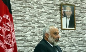 Afghanistan's acting Defense Minister Masoom Stanekzai speaks during an interview with The Associated Press at the defense ministry in Kabul, Afghanistan, Monday, Oct. 19, 2015. Stanekzai said Monday that the Doctors Without Borders hospital in Kunduz that was bombed by U.S. forces on Oct. 3 killing at least 22 people and wounding many more, was being used by Taliban insurgents and possibly Pakistani operatives as a "safe place." Doctors Without Borders also known by its French acronym MSF, has repeatedly denied the presence of Taliban fighters on the hospital compound at the time of the attack. A portrait of Afghan President Ashraf Ghani hangs on the wall. (AP Photo/Massoud Hossaini)