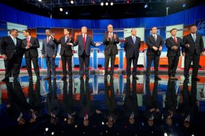 FILE - In this Aug. 6, 2015, file photo, Republican presidential candidates from left, Chris Christie, Marco Rubio, Ben Carson, Scott Walker, Donald Trump, Jeb Bush, Mike Huckabee, Ted Cruz, Rand Paul, and John Kasich take the stage for the first Republican presidential debate in Cleveland.  Eleven top-tier Republican presidential hopefuls face off in their second prime-time debate of the 2016 campaign Sept. 16, in a clash between outsiders and establishment candidates under a cathedral of political conservatism. (AP Photo/Andrew Harnik, File)