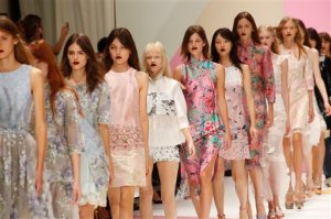 A model wears a creation by Taiwanese fashion house Shiatzy Chen as part of its Spring-Summer 2016 ready-to-wear fashion collection, presented during the Paris Fashion Week in Paris, France, Tuesday, Oct. 6, 2015. (AP Photo/Jerome Delay)