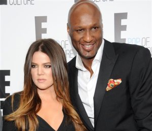 FILE - In this April 30, 2012 file photo, Khloe Kardashian Odom and Lamar Odom from the show "Keeping Up With The Kardashians" attend an E! Network upfront event at Gotham Hall in New York. Odom, the former NBA star and reality TV personality embraced by teammates and fans alike for his humble approach to fame, was hospitalized and his estranged wife Khloe Kardashian is by his side, after being found unresponsive in a Nevada brothel where he had been staying for days. (AP Photo/Evan Agostini, File)
