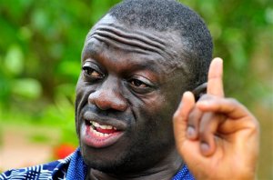 FILE - In this Wednesday, April 20, 2011 file photo, opposition leader Kiiza Besigye speaks during a rally in Kampala, Uganda. An opposition leader in Uganda who is running for president is under house arrest to prevent him from holding rallies that have been called illegal by the government, a police spokeswoman said. Kiiza Besigye of the Forum for Democratic Change party is being detained in his own home near the capital, Kampala, as a preventive measure to ensure that there is no breach of peace, said police spokeswoman Polly Namaye on Thursday, Oct. 15, 2015. (AP Photo/Ronald Kabuubi,File)