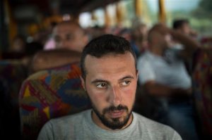 Mohammed al-Haj, a 26-year-old from Aleppo, was one of more than 600,000 migrants and refugees who flowed into Europe so far this year. Nearly half of those were Syrians, like Mohammed, fleeing their countrys brutal civil war. The Associated Press followed Mohammed on nearly every step of his 2,500-mile journey in September, starting from Killis, Turkey, where his family lived for a year after escaping Syria. Mohammed said that for him, Syria is finished. It will only get worse and finally break apart. Europe means a life of dignity, where at least ... I will feel I have rights. He his seen here on Sept. 10, 2015 as he travels by bus to the Macedonian border. (AP Photo/Santi Palacios)