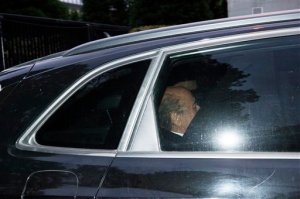 Outgoing FIFA President Sepp Blatter sits in the back of a car as he leaves the FIFA headquarters in Zurich, Switzerland, Thursday, Oct 8, 2015, after he was provisionally banned for 90 days by FIFA ethics committee. (Dominic Steinmann/Keystone via AP)