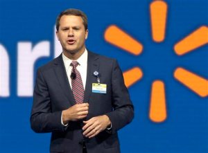 FILE - In this June 5, 2015 file photo, Wal-Mart Store, Inc., Chief Executive Officer Doug McMillon speaks at the Wal-Mart shareholder meeting in Fayetteville, Ark. Wal-Mart on Wednesday, Oct. 14, 2015 said it expects profit to fall for its next fiscal year and cut its sales outlook for this year as it works to fend off intensifying competition and perk up stores with better customer service. (AP Photo/Danny Johnston, File)