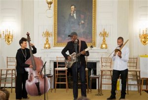 In this photo taken Oct. 14, 2015, jazz musician Esperanza Spalding, from left, Grammy award-winning blues musician Keb Mo, and trombone and trumpet player from New Orleans, La., Trombone Shorty, perform during an interactive student workshop with middle school students from the Washington area, in the State Dining Room of the White House in Washington. Whether belting out lyrics to Al Greens "Lets Stay Together," leading a mournful congregation through "Amazing Grace," or tweeting his Spotify music playlist that includes Stevie Wonder and Nina Simone, President Barack Obama is showing that hes a pretty soulful guy. (AP Photo/Manuel Balce Ceneta)