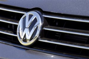 FILE - In this Sept. 24, 2015, file photo, the grille of a Volkswagen car for sale is decorated with the iconic company symbol in Boulder, Colo. Volkswagen said Monday, Oct. 12, 2015, it is recalling 1,950 diesel vehicles in China while Singapore announced it is suspending sales of the companys diesel cars in the wake of the German automakers emissions cheating scandal.  (AP Photo/Brennan Linsley,File)