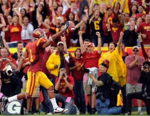 FILE - In this Saturday, Nov. 1, 2008 file photo, Southern California wide receiver Patrick Turner scores a touchdown during the first half of an NCAA college football game against Washington in Los Angeles. USC won 56-0. In 2010, researchers published a study suggesting that in the county that the football team is from, a win within 10 days before Election Day gave a small ballot-box boost to the party of the incumbent senator, governor or president. But a new analysis published on Monday, Oct. 26, 2015 concludes the original result was just a statistical fluke. (AP Photo/Mark J. Terrill, File)