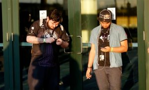 Professional gamers take a break outside the Major League Gaming World Finals in New Orleans, Friday, Oct. 16, 2015. Thousands of people are converging on New Orleans this weekend for the tournament. Players from around the world are competing in such games as Call of Duty: Advanced Warfare and Dota 2. The event started Friday and goes through Sunday at the convention center. (AP Photo/Gerald Herbert)