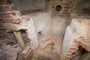 ADVANCE FOR SUNDAY OCT. 18 AND THEREAFTER - This Wednesday Sept. 23, 2015 photo provided by the University of Virginia shows a chemical hearth found in the Rotunda at the University of Virginia during a renovation at the school in Charlottesville, Va.  (Dan Addison/University of Virginia via AP)