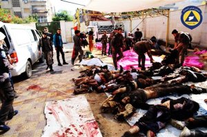 This photo provided by the Syrian anti-government activist group Syrian Civil Defence, as also known as the White Helmets, which has been authenticated based on its contents and other AP reporting, shows bodies lies on the ground following what witnesses said government forces fired more than 11 missiles at a market in Douma, Syria, Friday, Oct. 30, 2015. The Syrian Observatory for Human Rights and the Local Coordination Committees group said government forces fired more than 11 missiles at a market in Douma, killing at least 40. (Syrian Civil Defence via AP)