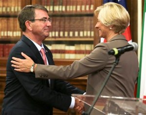 Italian Defense Minister Roberta Pinotti, right, and US Secretary of Defense Ashton Carter shake hands at the end of joint press conference on the occasion of their bilateral meeting, in Rome, Wednesday, Oct. 7, 2015.  (AP Photo/Andrew Medichini)