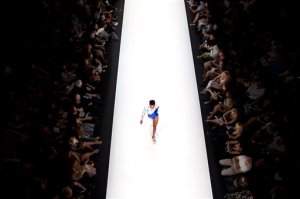 In this Tuesday, Oct. 20, 2015 photo, a model walks the runway in the Ori Minkovsky show during Fashion Week in Tel Aviv, Israel. The show came at a time of escalating regional tensions that began with clashes at a Jerusalem holy site last month and quickly spread across Israel, the West Bank and Gaza. (AP Photo/Oded Balilty)