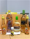 In this Oct. 5, 2015 photo provided U.S. Customs and Border Protection, bottles labeled oil and vinegar that contain liquid cocaine sit on a table in at private search room at New Yorks John F. Kennedy International Airport. Law enforcement officials say a passenger who flew into the airport had the bottles stored in his luggage. (U.S. Customs and Border Protection via AP)