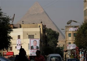 Banners of parliamentary candidate "Mohammed Ghorab", are seen in front of the historical site of the Giza Pyramids, near Cairo, Egypt, Wednesday, Oct. 14, 2015. Egypt's long-awaited parliamentary elections will start on Oct. 18-19, a hoped-for step toward democracy amid a harsh crackdown on dissent. The second stage of the staggered vote will take place on Nov. 22-23. Final results will be announced in early December. (AP Photo/Amr Nabil)