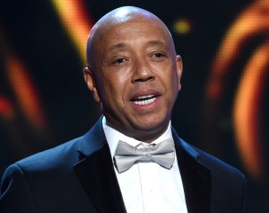 FILE - In this Feb. 6, 2015, file photo, hip-hop mogul Russell Simmons presents the Vanguard Award on stage at the 46th NAACP Image Awards in Pasadena, Calif. RushCard, the pre-paid debit card backed by Simmons, is creating a multi-million dollar fund to help cover the costs that its customers had while the card was beset by technical problems. RushCard customers who had late fees tied to bills or any other financial setbacks as a direct result of their money being locked up with RushCard will be compensated, the company said. (Photo by Chris Pizzello/Invision/AP, File)