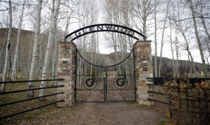 The Glenwood Cemetery gate is shown Thursday, Oct. 29, 2015, in Park City, Utah. Lawyers for the family of 4-year-old Utah boy crushed by a tombstone at the cemetery say he died after shoddy maintenance left the historic headstone weak and dangerous. The Glenwood Cemetery Association contends that the cemetery was well-maintained and the 1889 headstone was solid before the boy started playing on it on July 5, 2012. (AP Photo/Rick Bowmer)
