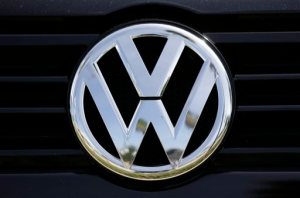 The Volkswagen logo is seen on car offered for sale at New Century Volkswagen dealership in Glendale, Calif., Monday, Sept. 21, 2015. Volkswagen shares plunged Monday after U.S. regulators accused the German automaker of cheating on emissions tests, alleging that nearly 500,000 cars weren't meeting federal standards. (AP Photo/Damian Dovarganes)