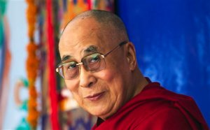 FILE- In this Oct. 10, 2015 file photo, Tibetan spiritual leader the Dalai Lama arrives at a Tibetan school, in Dharmsala, India. The Dalai Lama is urging the world's nations to take strong action to limit global warming and protect fragile environments including the Himalayan glaciers and Tibetan plateau.The 80-year-old Tibetan Buddhist spiritual leader issued his plea in a pre-taped video released as part of a campaign launched by the Tibetan government-in-exile in the north Indian hill town of Dharmala, where the Dalai Lama is based.(AP Photo/Ashwini Bhatia, file)