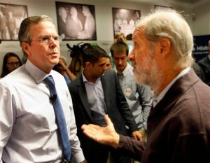 Republican presidential candidate, former Florida Gov. Jeb Bush is questioned after announcing his plan to end President Obama's health care law, Tuesday, Oct. 13, 2015, at the New Hampshire Institute of Politics at Saint Anselm College in Manchester,NH (AP Photo/Jim Cole)