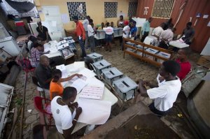 Electoral members work at a voting station set up at a government office in Port-au-Prince, Haiti, Sunday, Oct. 25, 2015. The country is holding a first-round presidential vote along with balloting for numerous legislative races and local offices.  (AP Photo/Dieu Nalio Chery)