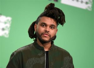 FILE - In this Aug. 30, 2015 file photo, The Weeknd poses in the press room at the MTV Video Music Awards in Los Angeles. The Canadian R&B artist known as The Weeknd has pleaded no contest to punching a Las Vegas police officer in a hotel scuffle in January. Defense attorney Shane Emerick declined comment Monday, Oct. 26, 2015, about Abel Tesfayes no contest plea last Wednesday to a misdemeanor battery charge.  (Photo by Richard Shotwell/Invision/AP, File)