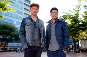 In this Oct. 3, 2015 photo, co-directors South Korean Choi Wooyoung, right, and Belgian Steven Dhoedt pose for a photo in Seoul, South Korea. Reach for the SKY, a documentary film directed by them about the social and personal costs of South Koreans craze for being admitted to the nations top three universities, depicts a system that is a far cry from U.S. President Barack Obamas praise of the Asian country as a model for U.S. educational reforms. The documentary, a co-production of Belgium and South Korea, premiered during the 20th Busan International Film Festival, which ends Saturday, Oct. 10, 2015. (AP Photo/Lee Jin-man)