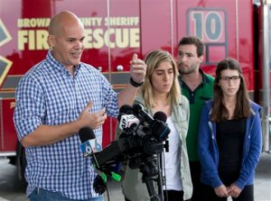 Passengers of Dynamic Airways Boeing 767, from left; Andres Gallegos, Camilia Diaz, David Magro and his sister Daniela Magro, all from Venezuela, talk to the media, Thursday, Oct. 29, 2015, at Fort Lauderdale/Hollywood International Airport in Dania Beach, Fla. The passenger plane's engine caught fire Thursday as it prepared for takeoff, and passengers had to quickly evacuate on the runway using emergency slides, officials said. he plane was headed to Caracas, Venezuela. (AP Photo/Wilfredo Lee)