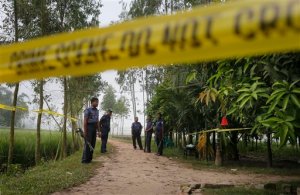 Bangladeshi security officers stand by the site where a Japanese Kunio Hoshi was killed at Mahiganj village in Rangpur district, 300 kilometers (185 miles) north of Dhaka, Bangladesh, Sunday, Oct. 4, 2015. Masked assailants riding a motorbike shot and killed Kunio Hoshi on Saturday, police said. The Islamic State group issued a statement claiming responsibility for the attack, according to the SITE Intelligence Group, which monitors jihadi postings online. The report could not be independently confirmed. The extremist group also claimed responsibility for the killing of an Italian aid worker last Monday. (AP Photo/A.M. Ahad)