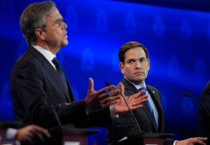 Marco Rubio, right, watches as Jeb Bush speaks during the CNBC Republican presidential debate at the University of Colorado, Wednesday, Oct. 28, 2015, in Boulder, Colo. (AP Photo/Mark J. Terrill)