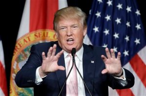 Republican presidential candidate Donald Trump gestures as he addresses supporters during a campaign stop at the Trump National Doral Miami resort, Friday, Oct. 23, 2015 in Doral, Fla.. (AP Photo/Alan Diaz)