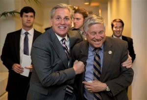 House Majority Leader Kevin McCarthy of Calif., left, and Rep. Fred Upton, R-Mich., laugh together as they walk from a meeting on Capitol Hill in Washington, Monday, Oct. 26, 2015. Speaker John Boehner is pressing ahead with one last deal as he heads for the exits, pushing to finalize a far-reaching, two-year budget agreement with President Barack Obama before handing Congress' top job over to Rep. Paul Ryan this week, congressional officials said Monday.(AP Photo/Carolyn Kaster)