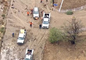 This still frame from video provided by KABC-TV shows vehicles stuck in a muddy road in the mountainous community of Lake Hughes, Calif., about 65 miles north of downtown Los Angeles, Thursday, Oct. 15, 2015. Flash flooding in northern Los Angeles County has filled several roads with mud, stranding vehicles and blocking traffic on one of the states main highways. (KABC-TV via AP) MANDATORY CREDIT; TV OUT