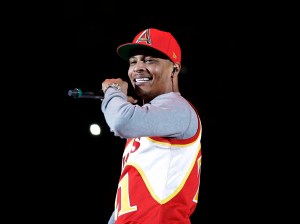 FILE - In this Nov. 1, 2014, file photo, rapper T.I. performs before the start of an NBA basketball game between the Indiana Pacers and the Atlanta Hawks in Atlanta. T.I. has changed his stage name to his childhood name of Tip, and with his new EP "Da' Nic," he's gone independent, breaking away from a label for the first time. (AP Photo/David Goldman, File)
