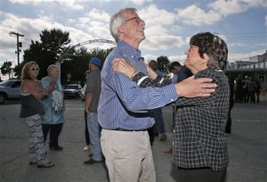 Kim Van Atta, left, a friend of death row inmate Richard Glossip, celebrates with death penalty opponent Sister Helen Prejean, right, outside the Oklahoma State Penitentiary in McAlester, Okla, Wednesday, Sept. 30, 2015, after Glossip's scheduled execution was postponed. Oklahoma Gov. Mary Fallin postponed an inmate's scheduled execution Wednesday, saying a drug that the state Department of Corrections had received to carry out a lethal injection didn't match those listed in the agency's protocols.  (AP Photo/Sue Ogrocki)