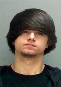 This undated photo provided by the Salt Lake County Jail shows Cody Jackson.  Authorities say Jackson, an Ohio man on an electronic monitor in a pending criminal case had a 14-year-old girl dropped off at his home by taxi, held her captive for months and raped her.  Jackson, 20, is charged with federal counts of coercion and enticement of a minor to engage in illegal sexual activity and production of child pornography.(Salt Lake County Jail via AP)
