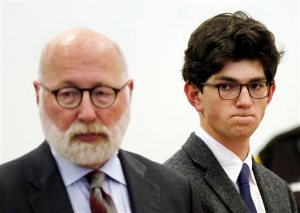 Owen Labrie, right, listens to prosecutors with his lawyer J.W. Carney, left, before being sentenced in Merrimack County Superior Court, Thursday, Oct. 29, 2015, in Concord, N.H. The graduate of the exclusive St. Pauls School was sentenced to a year in jail for sexually assaulting a 15-year-old freshman girl as part of a tradition in which upperclassmen competed to rack up sexual conquests. Labrie was allowed to remain free on bail while he appeals his conviction. (AP Photo/Jim Cole, Pool)