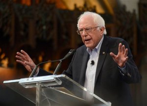 In this Sept. 28, 2015 photo, Democratic presidential candidate Sen. Bernie Sanders, I-Vt. speaks at the University of Chicago in Chicago. Sanders raised about $26 million for his presidential campaign in the past three months, his campaign said Wednesday, nearly matching the $28 million take of Democratic front-runner Hillary Rodham Clinton. (AP Photo/Paul Beaty)